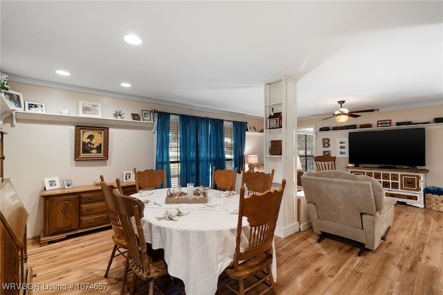 dining room featuring light hardwood / wood-style floors, ceiling fan, and ornamental molding