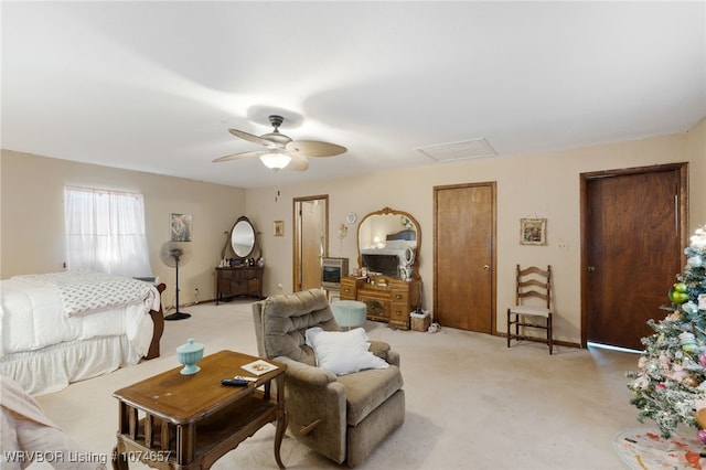 carpeted living room with ceiling fan