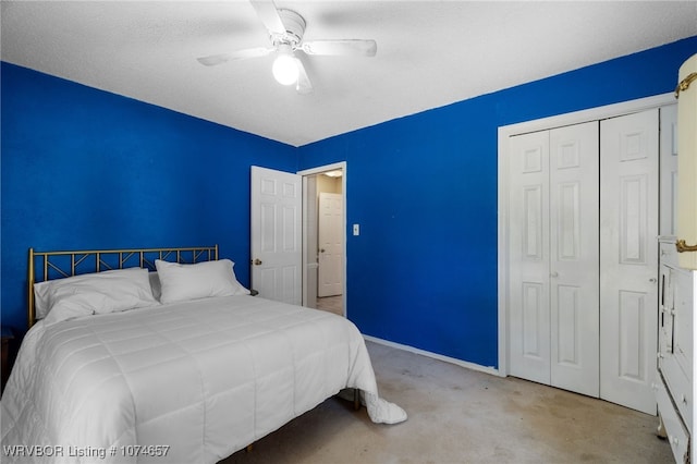 bedroom featuring ceiling fan, a closet, light colored carpet, and a textured ceiling