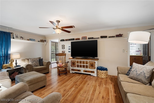 living room featuring hardwood / wood-style floors, ceiling fan, and crown molding