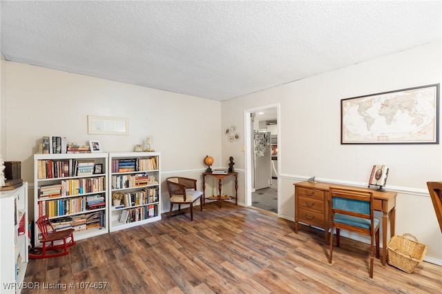 office area with a textured ceiling and hardwood / wood-style flooring