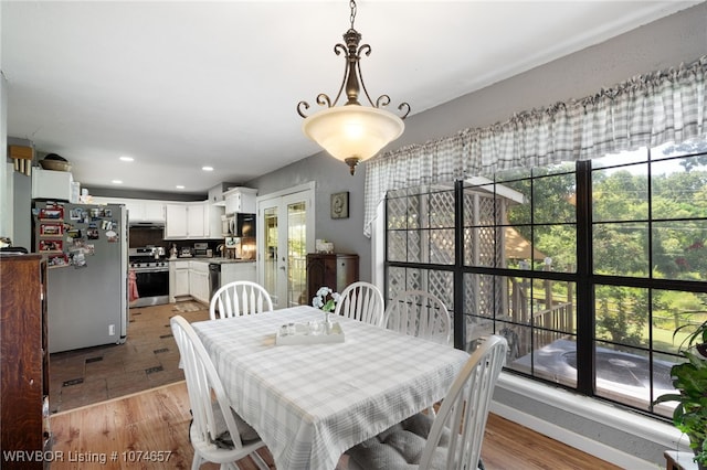 dining space featuring light hardwood / wood-style flooring