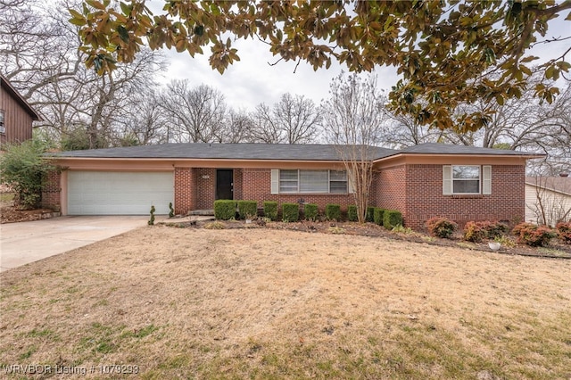 ranch-style house featuring a garage, concrete driveway, brick siding, and a front lawn