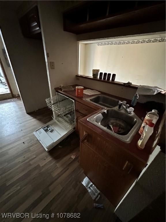 kitchen with sink and wood-type flooring