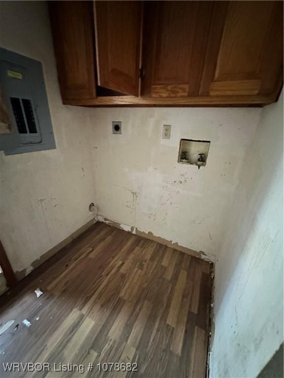 clothes washing area with cabinets, dark hardwood / wood-style floors, electric panel, electric dryer hookup, and washer hookup