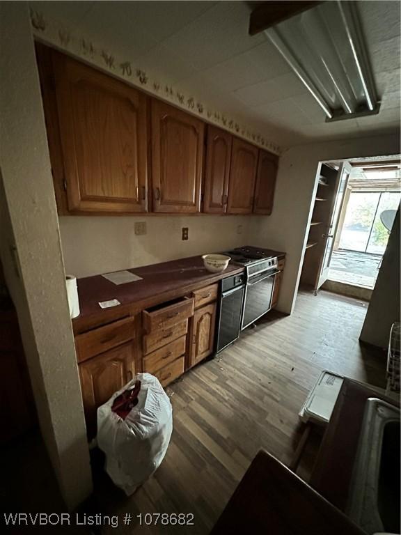 kitchen featuring light hardwood / wood-style flooring and stove