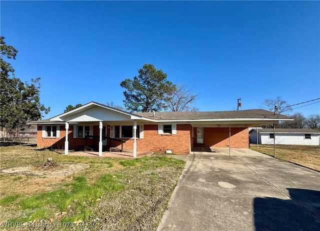 ranch-style home with a carport and a front lawn