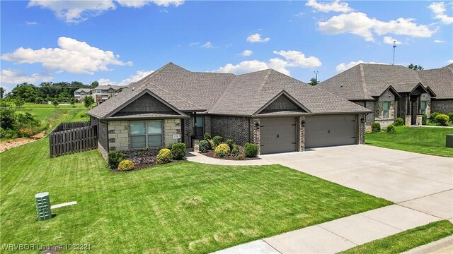 1228 Bradley St, Centerton, AR 72719 - french country home with an attached garage, driveway, brick siding, and stone siding