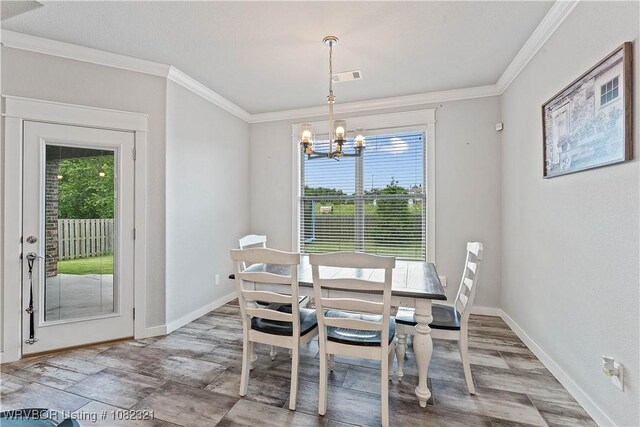 1228 Bradley St, Centerton, AR 72719 - dining room with a chandelier and crown molding