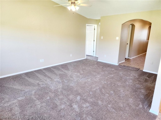 unfurnished room with ceiling fan and carpet floors