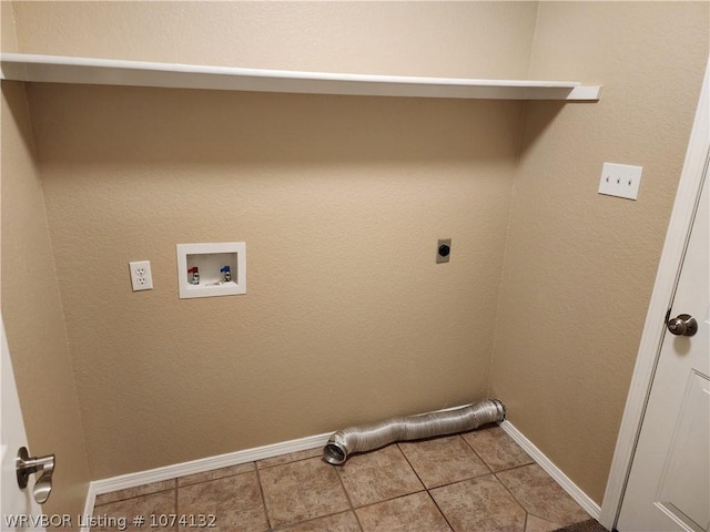 washroom with electric dryer hookup, hookup for a washing machine, and tile patterned flooring