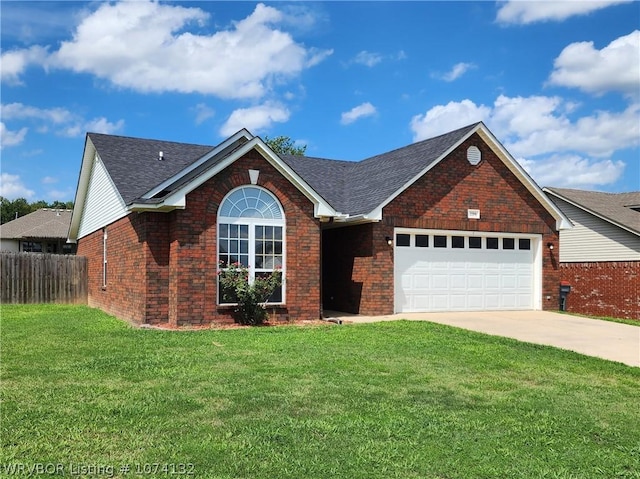 view of front of property featuring a garage and a front lawn