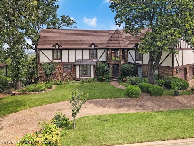 3417 Royal Scots Way, Fort Smith, AR 72908 - english style home featuring stone siding, stucco siding, and a front lawn