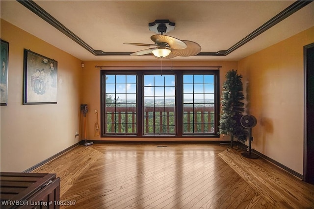 3417 Royal Scots Way, Fort Smith, AR 72908 - empty room featuring ceiling fan, plenty of natural light, and hardwood / wood-style floors