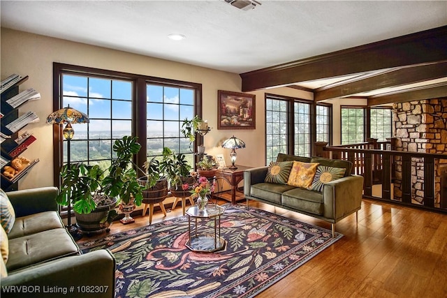 3417 Royal Scots Way, Fort Smith, AR 72908 - living area with wood finished floors, beamed ceiling, and recessed lighting