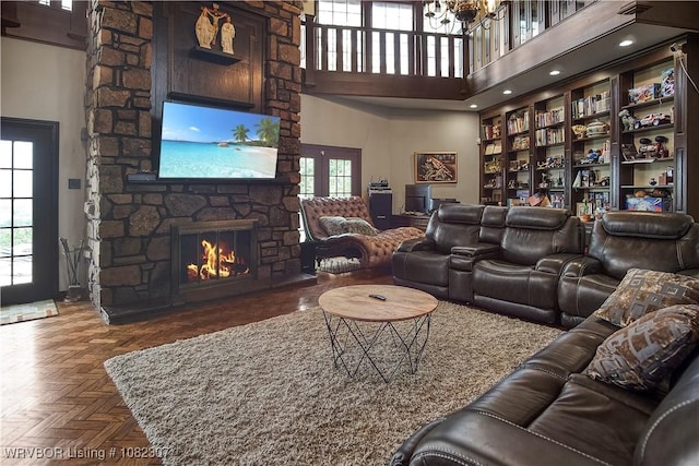 3417 Royal Scots Way, Fort Smith, AR 72908 - living area with a towering ceiling, a fireplace, and a chandelier