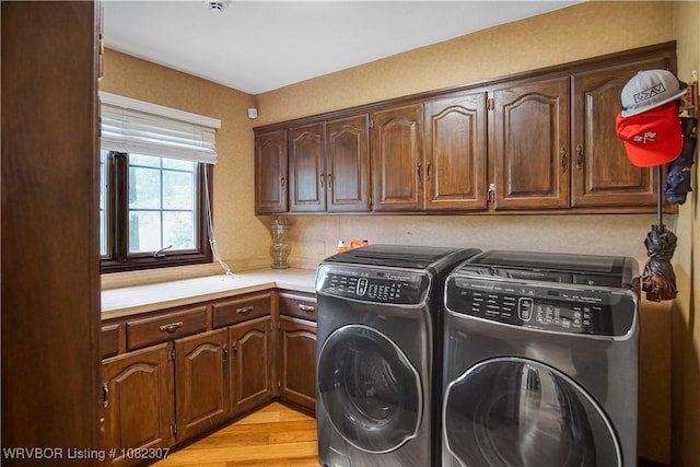 3417 Royal Scots Way, Fort Smith, AR 72908 - laundry room featuring cabinet space, washing machine and dryer, and light wood-style floors