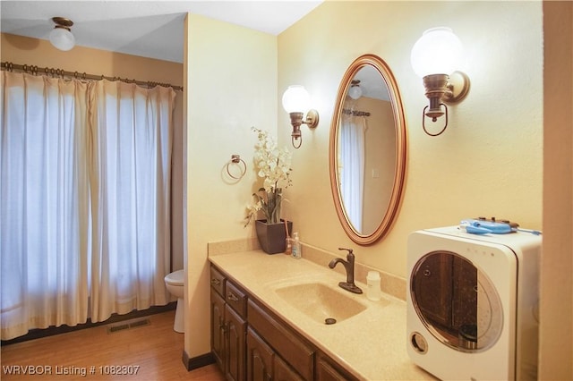 3417 Royal Scots Way, Fort Smith, AR 72908 - full bathroom with washer / clothes dryer, vanity, wood finished floors, and a shower with shower curtain