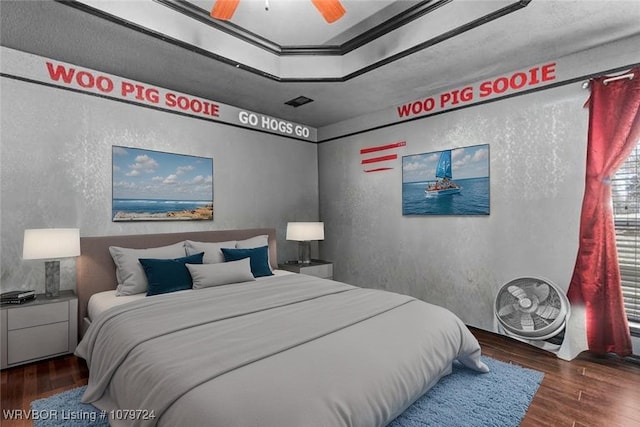 2702 Rambo Cir, Lavaca, AR 72941 - bedroom featuring a textured wall, wood finished floors, and ceiling fan