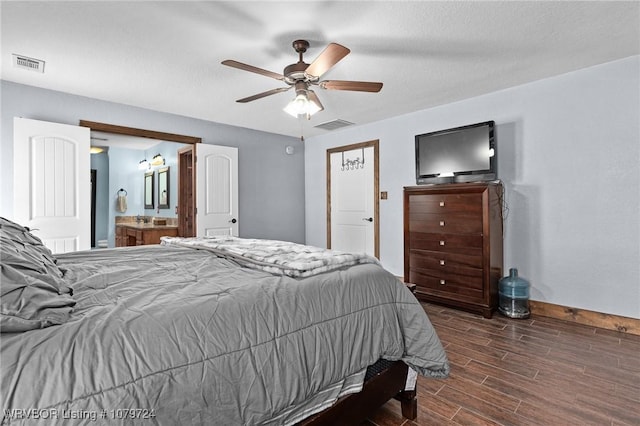 2702 Rambo Cir, Lavaca, AR 72941 - bedroom with wood finished floors, ceiling fan, and ensuite bath