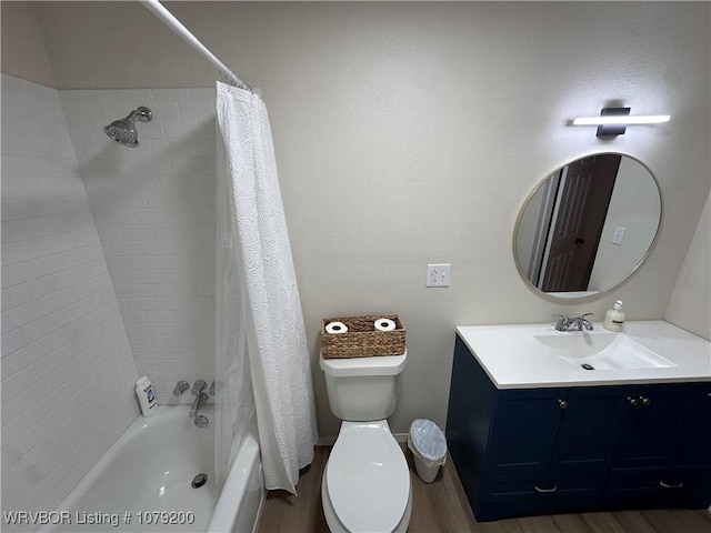 bathroom featuring shower / tub combo, vanity, toilet, and wood finished floors