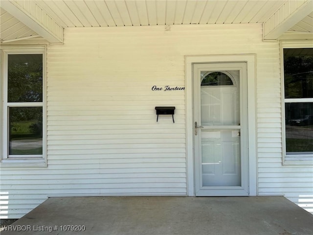 entrance to property with a patio