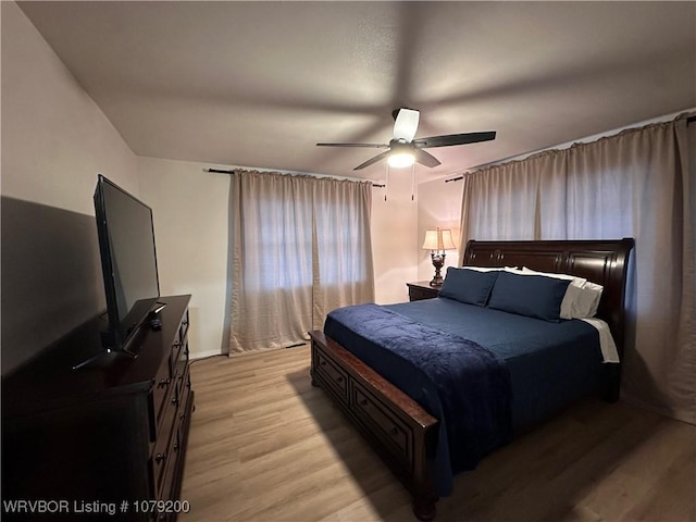 bedroom featuring light wood-style floors and ceiling fan