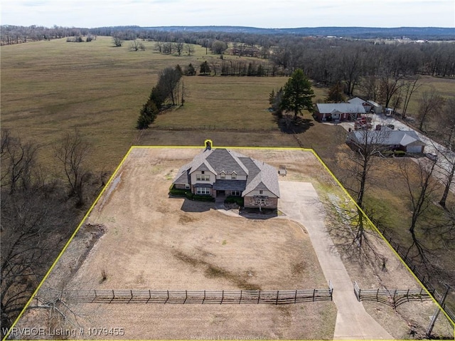 birds eye view of property with a rural view