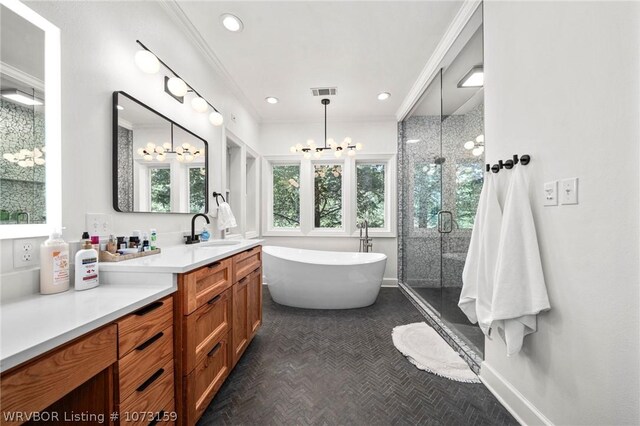 10101 Stephens Ct, Fort Smith, AR 72908 - bathroom featuring a chandelier, a shower stall, vanity, a freestanding tub, and crown molding