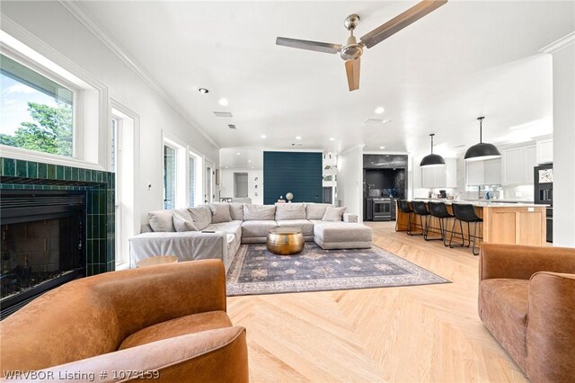 10101 Stephens Ct, Fort Smith, AR 72908 - living room with a fireplace, a ceiling fan, ornamental molding, and recessed lighting