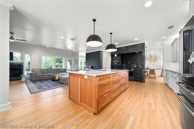 10101 Stephens Ct, Fort Smith, AR 72908 - kitchen with crown molding, recessed lighting, a fireplace with raised hearth, light countertops, and ceiling fan