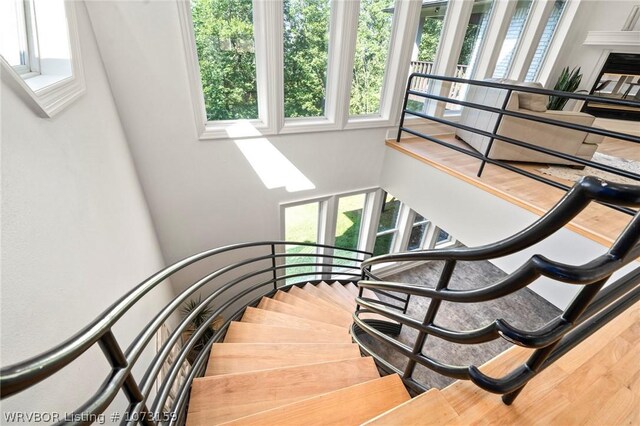 10101 Stephens Ct, Fort Smith, AR 72908 - stairs featuring a skylight and wood finished floors