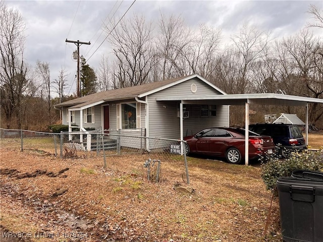 view of front of home featuring a carport