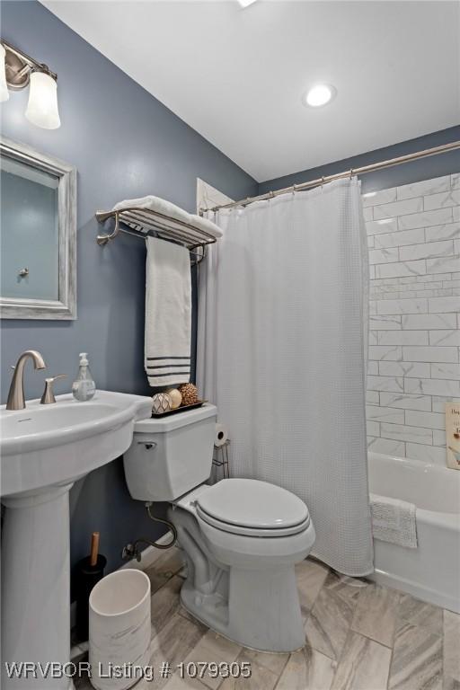 bathroom with toilet and shower / bath combination with curtain