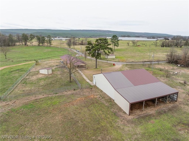 birds eye view of property with a rural view