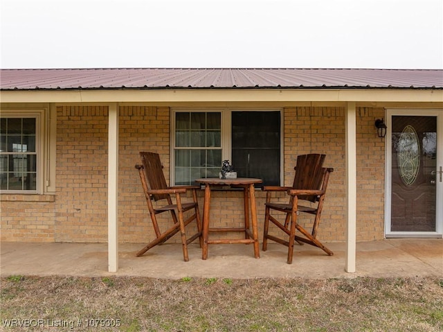 view of patio featuring outdoor dining area