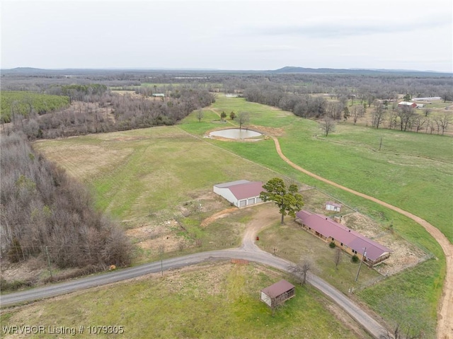 birds eye view of property featuring a rural view