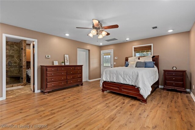 bedroom featuring light wood-style flooring, baseboards, and visible vents