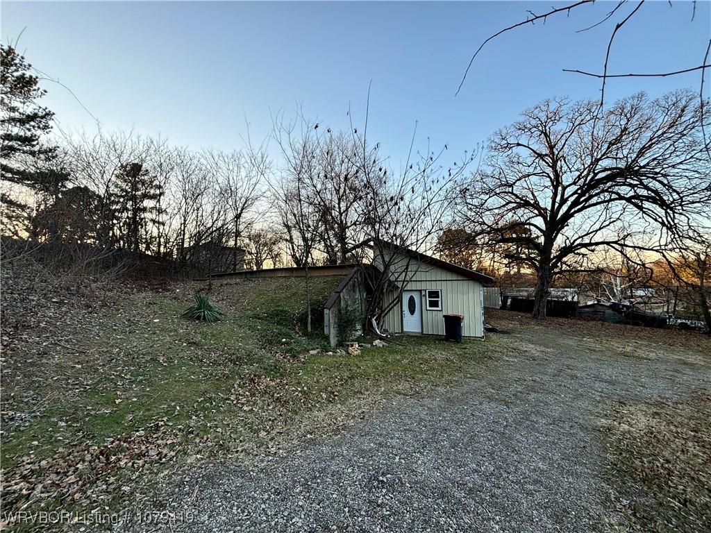 view of property exterior featuring an outdoor structure