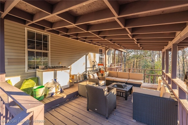 wooden terrace with an outdoor hangout area