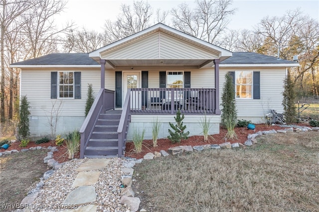 ranch-style house with covered porch