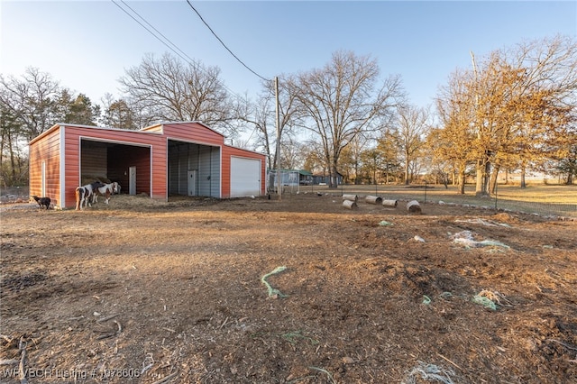 view of yard with an outbuilding and a garage