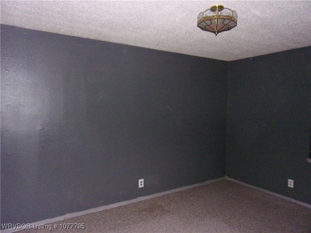 unfurnished room with carpet flooring