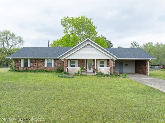 ranch-style home featuring an attached carport, driveway, covered porch, brick siding, and a front yard