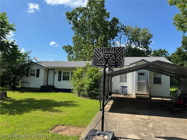 106 E Cedar St, Hackett, AR 72937 - view of front of property featuring entry steps, a carport, a front lawn, and a metal roof