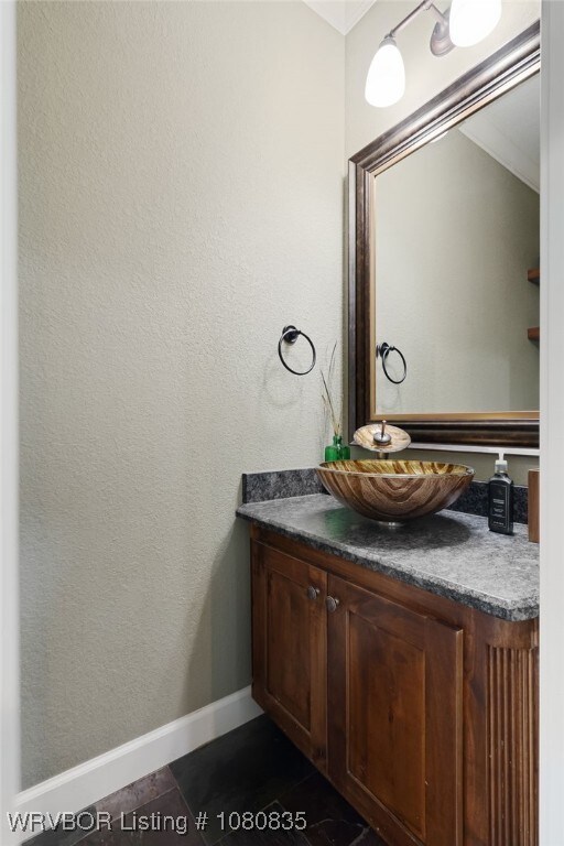 8205 Cisterna Way, Fort Smith, AR 72916 - bathroom with baseboards, tile patterned floors, and vanity