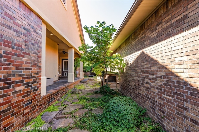 8205 Cisterna Way, Fort Smith, AR 72916 - view of side of property featuring brick siding and stucco siding