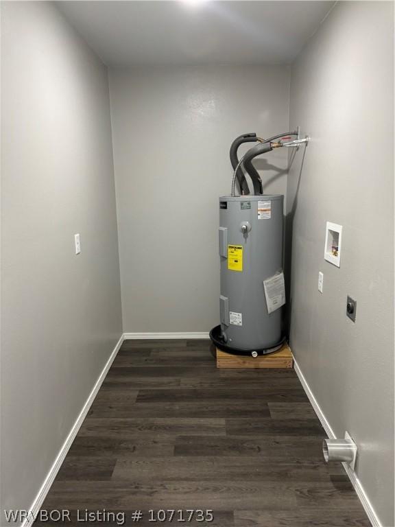 utility room with water heater