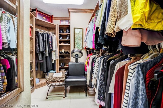 spacious closet with light tile patterned flooring