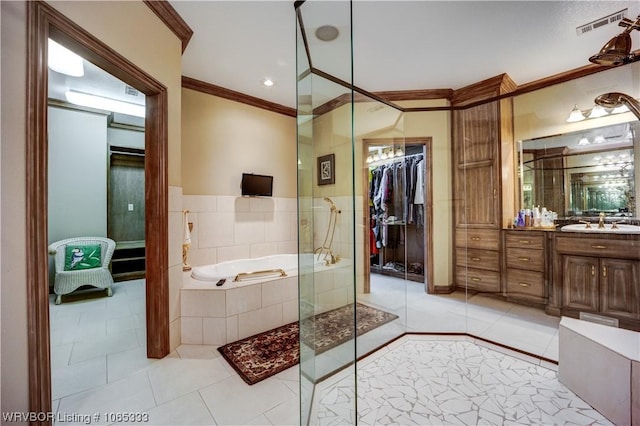 bathroom featuring vanity, shower with separate bathtub, and ornamental molding